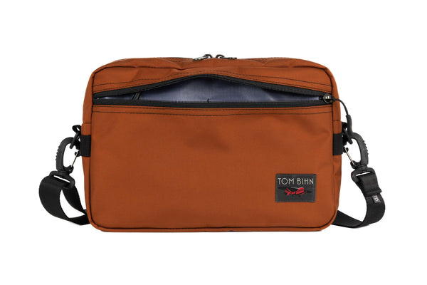 The Side Hustle in Burnt Orange Ballistic with Dusk 210 Cerylon interior.
